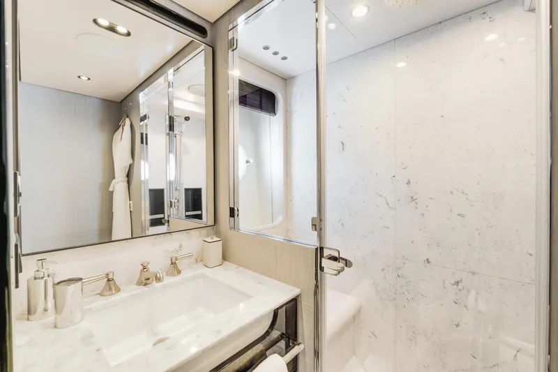  Yacht Photos Pics Luxurious bathroom in 2019 Azimut 27 Metri yacht with marble finishes and modern fixtures.