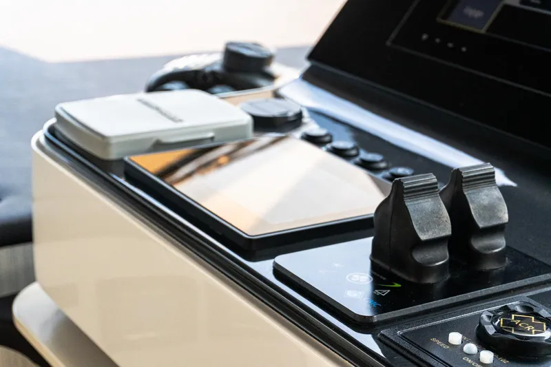  Yacht Photos Pics Control panel of a 2019 Azimut 27 Metri yacht, featuring modern navigation equipment.