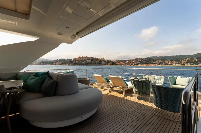  Yacht Photos Pics Luxurious 2019 Azimut 27 Metri yacht deck with coastal view and elegant seating.