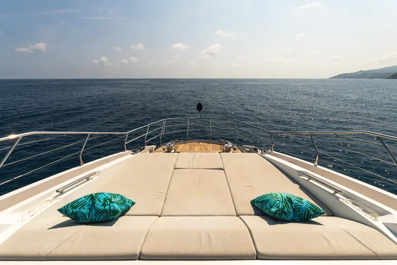  Yacht Photos Pics Luxurious 2019 Azimut 27 Metri yacht deck with cushions, overlooking serene ocean view.