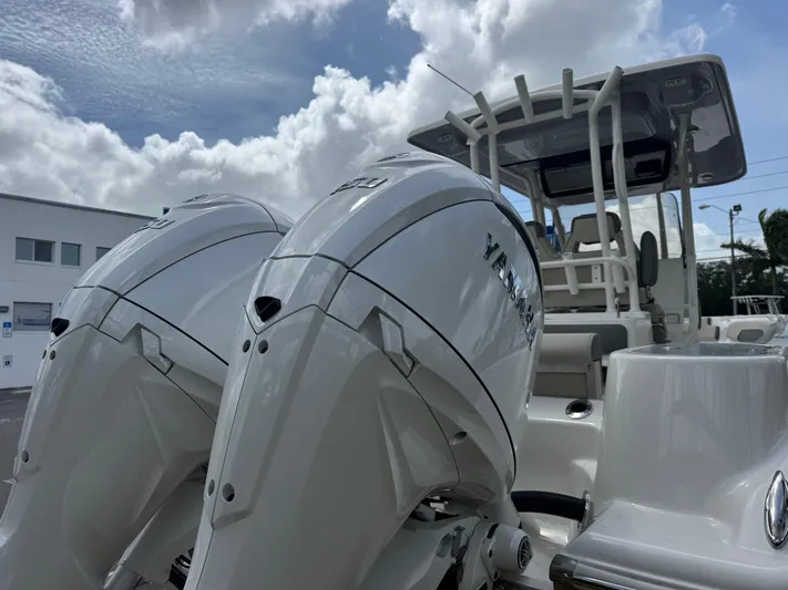  Yacht Photos Pics 2025 Key West 260 boat with dual Yamaha outboard engines under a cloudy sky.