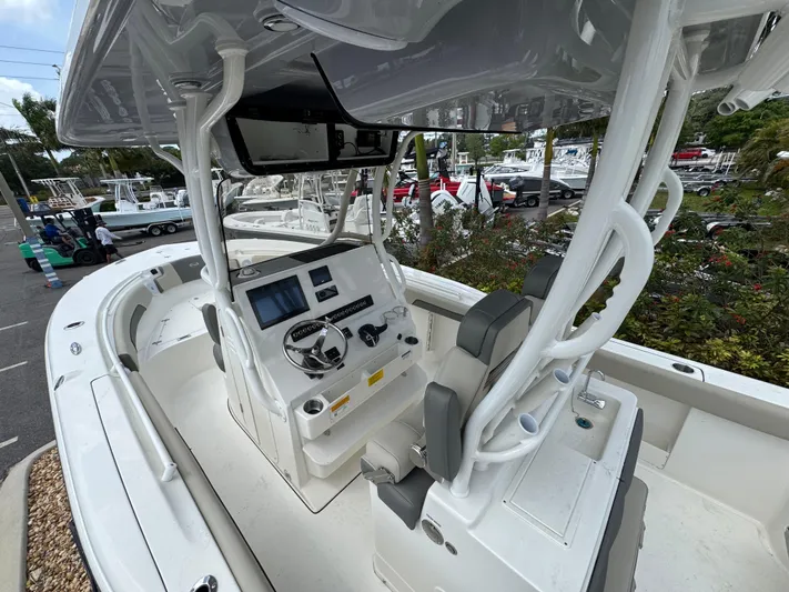  Yacht Photos Pics 2025 Key West 260 boat interior with modern helm and seating, displayed outdoors.