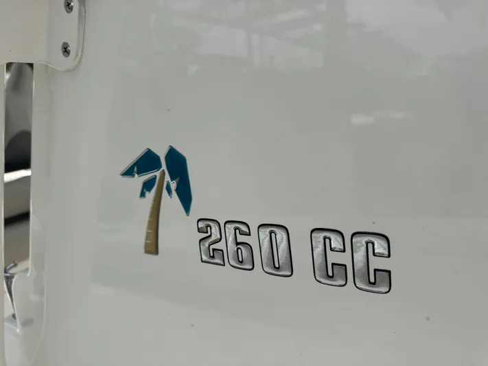  Yacht Photos Pics Key West 260 CC boat logo, 2025 model, featuring a palm tree design.