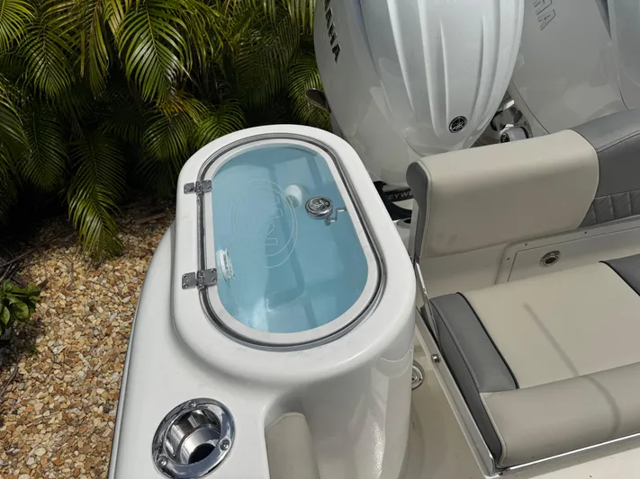  Yacht Photos Pics 2025 Key West 260 boat with livewell and seating, featuring a sleek design.