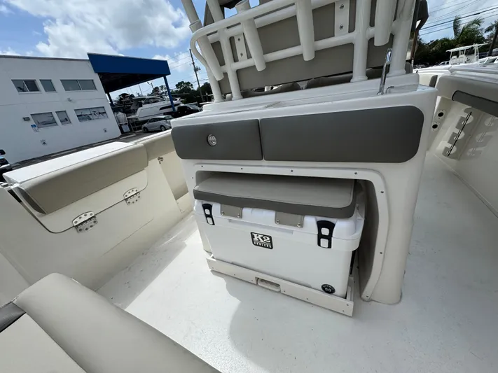  Yacht Photos Pics 2025 Key West 260 boat interior with seating and cooler storage.