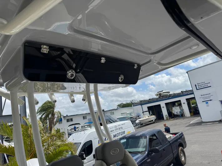  Yacht Photos Pics 2025 Key West 260 boat interior with overhead storage, parked in a marina.