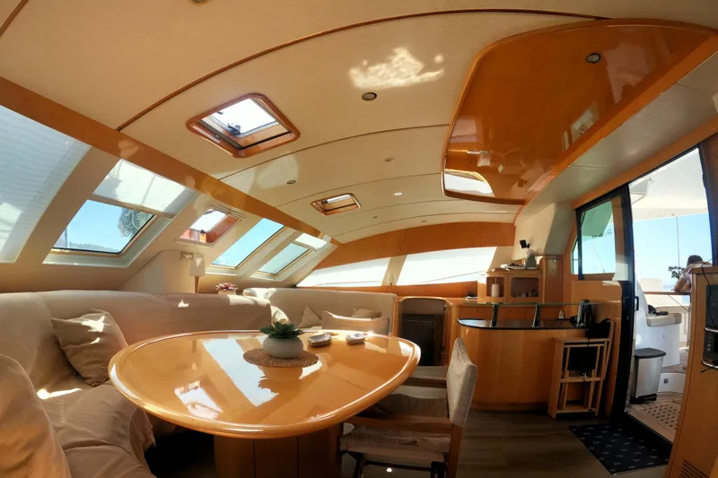 Audaz Yacht Photos Pics Luxurious interior of 2007 Privilege 615 yacht with elegant wood finishes and ample natural light.