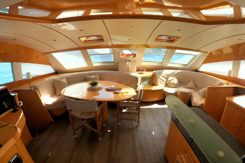 Audaz Yacht Photos Pics Luxurious interior of 2007 Privilege 615 yacht with elegant seating and dining area.