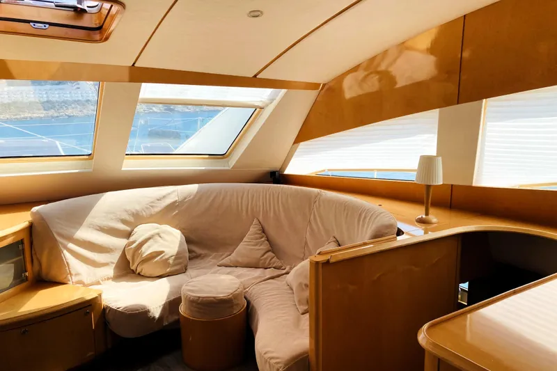 Audaz Yacht Photos Pics Luxurious interior of 2007 Privilege 615 yacht with cozy seating and panoramic windows.