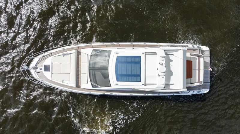 Knot On Call Yacht Photos Pics Aerial view of 2015 Azimut 55S yacht cruising on water.