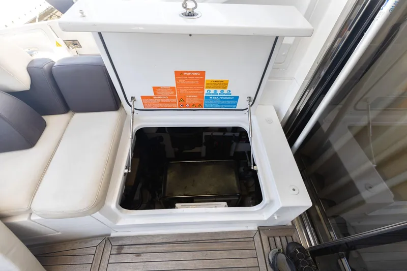 Knot On Call Yacht Photos Pics Open storage compartment on 2015 Azimut 55S yacht with safety labels.