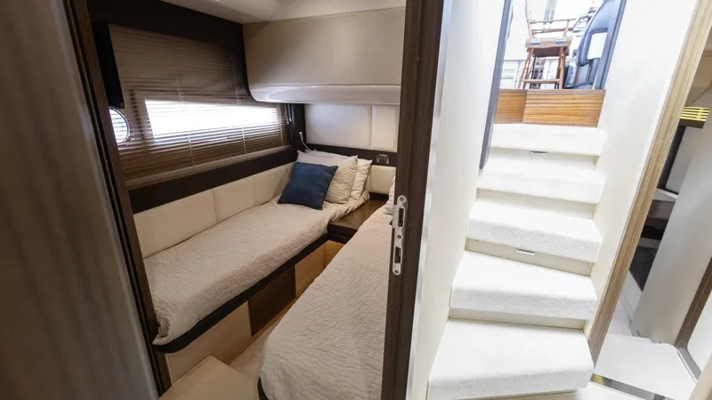 Knot On Call Yacht Photos Pics Interior cabin of 2015 Azimut 55S yacht with twin beds and modern decor.