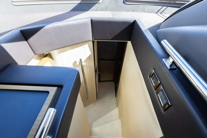 Knot On Call Yacht Photos Pics Interior stairs of 2015 Azimut 55S yacht, featuring modern design and sleek finishes.