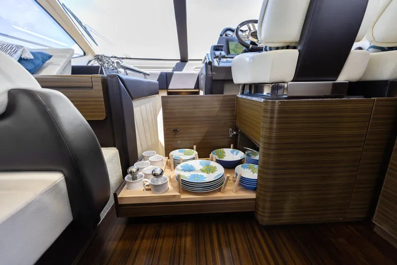 Knot On Call Yacht Photos Pics Interior of 2015 Azimut 55S yacht with elegant dining set storage.