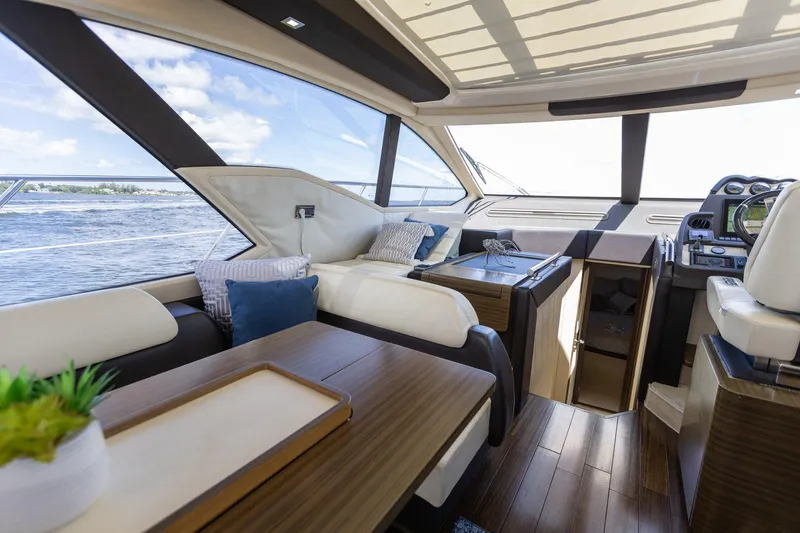 Knot On Call Yacht Photos Pics Luxurious interior of 2015 Azimut 55S yacht with modern furnishings and scenic ocean view.