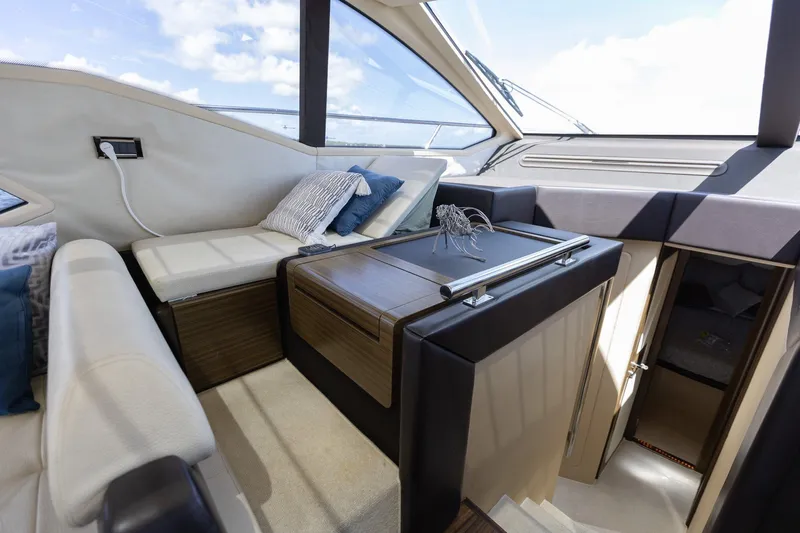 Knot On Call Yacht Photos Pics Luxurious interior of 2015 Azimut 55S yacht with modern seating and elegant design.
