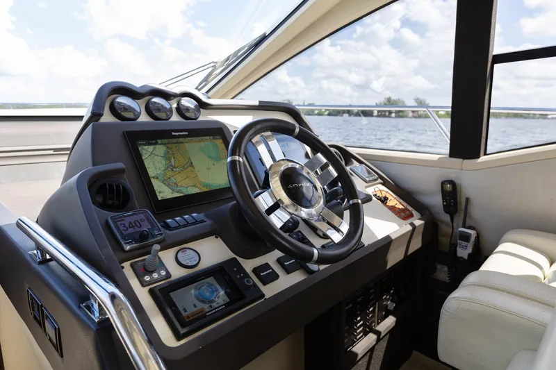 Knot On Call Yacht Photos Pics Luxury Azimut 55S 2015 yacht cockpit with advanced navigation system and leather seating.