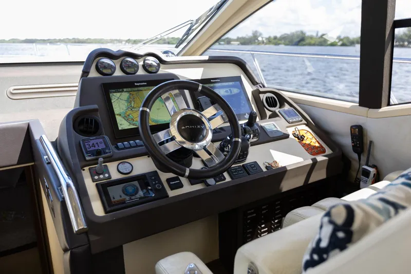 Knot On Call Yacht Photos Pics Cockpit of 2015 Azimut 55S yacht with modern navigation equipment and steering wheel.