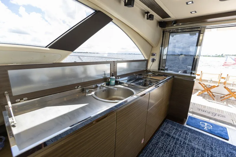 Knot On Call Yacht Photos Pics Azimut 55S 2015 yacht interior with modern kitchen and ocean view.