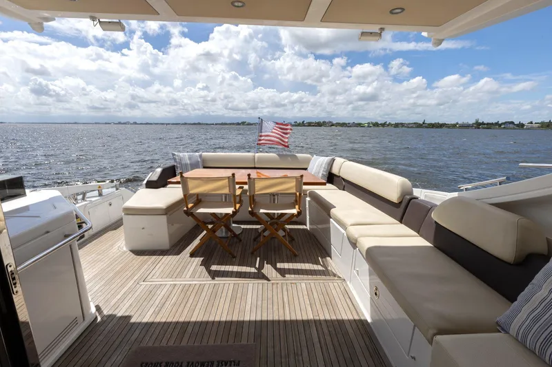 Knot On Call Yacht Photos Pics Azimut 55S 2015 yacht deck with seating, table, and ocean view.