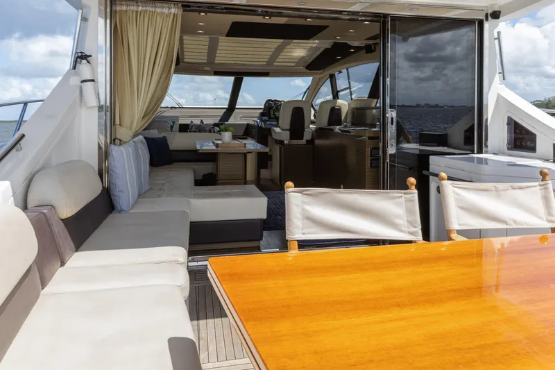 Knot On Call Yacht Photos Pics Luxurious 2015 Azimut 55S yacht interior with elegant seating and dining area.