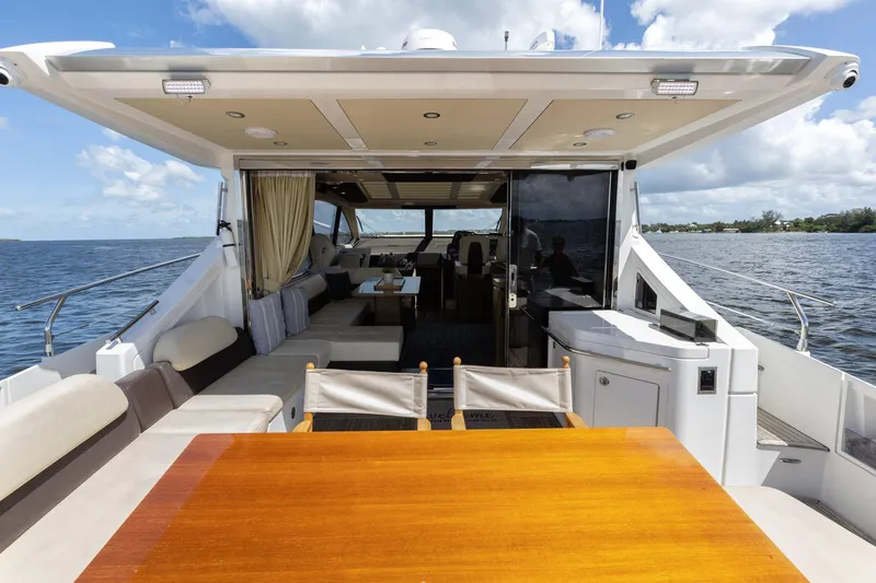 Knot On Call Yacht Photos Pics Luxurious 2015 Azimut 55S yacht interior with spacious seating and dining area.