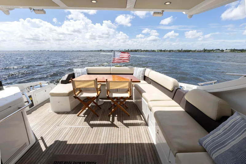 Knot On Call Yacht Photos Pics Azimut 55S 2015 yacht deck with seating, table, and ocean view.