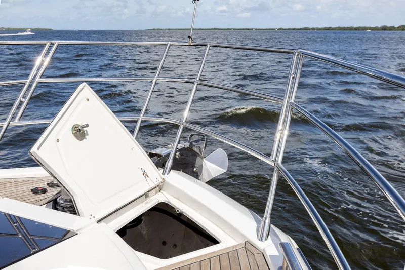 Knot On Call Yacht Photos Pics Azimut 55S 2015 yacht bow with open hatch, cruising on a sunny day.