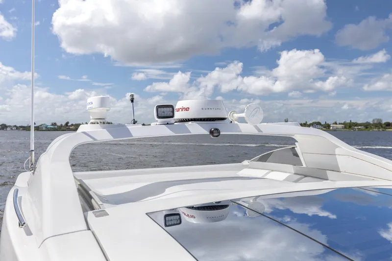 Knot On Call Yacht Photos Pics Azimut 55S yacht, 2015 model, cruising on a sunny day with blue skies.