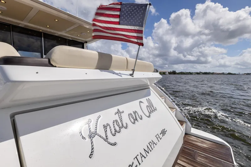 Knot On Call Yacht Photos Pics Azimut 55S yacht "Knot on Call" with American flag, Tampa, 2015.