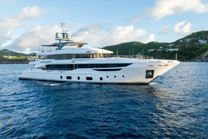 Watercolours Yacht Photos Pics Luxurious 2022 Benetti DIAMOND yacht cruising in scenic coastal waters.