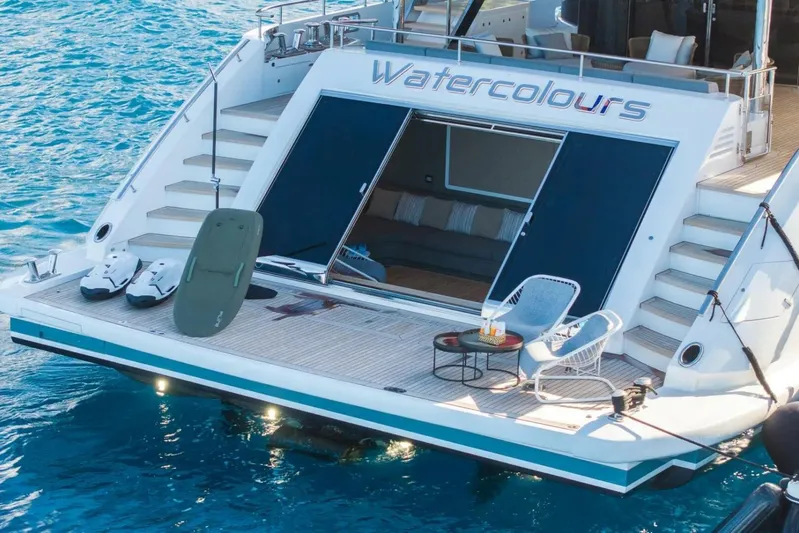 Watercolours Yacht Photos Pics Luxurious 2022 Benetti DIAMOND yacht with open deck, lounge chairs, and water sports equipment.