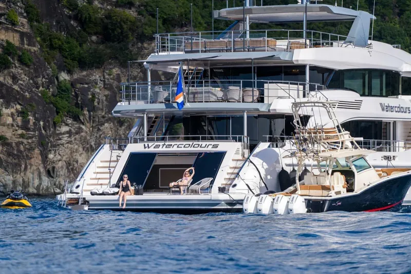 Watercolours Yacht Photos Pics Luxurious 2022 Benetti DIAMOND yacht "Watercolours" anchored near rocky coastline.