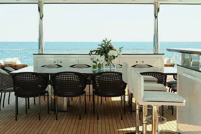 Watercolours Yacht Photos Pics Luxurious Benetti DIAMOND 2022 yacht deck with elegant dining area and ocean view.