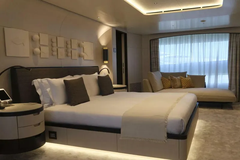 Watercolours Yacht Photos Pics Luxurious bedroom interior on 2022 Benetti DIAMOND yacht, featuring elegant decor and modern furnishings.