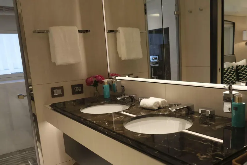 Watercolours Yacht Photos Pics Luxurious bathroom on 2022 Benetti DIAMOND yacht with double sinks and elegant decor.