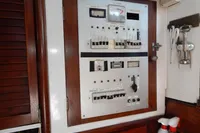 Electrical control panel on a 1944 Custom Schooner 22 m, featuring switches and meters.