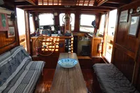 Interior of a 1944 Custom Schooner, featuring wooden decor and nautical elements.