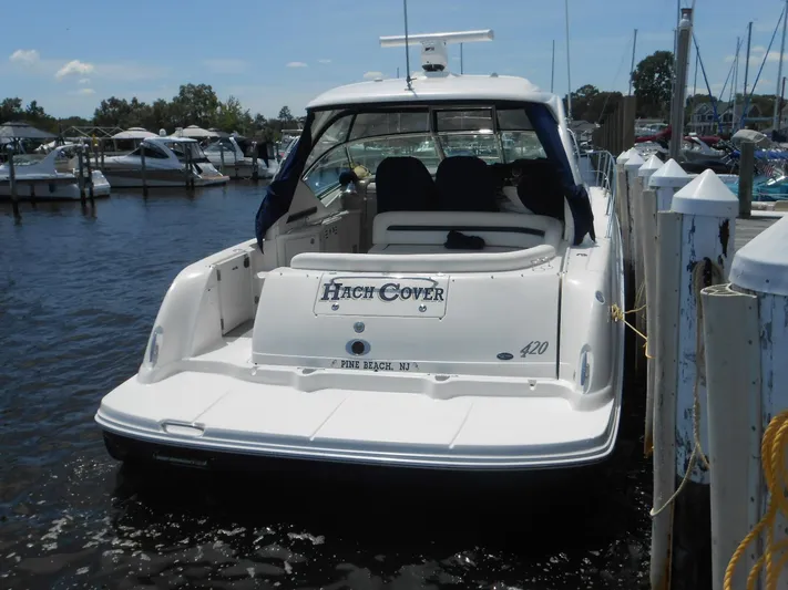  Yacht Photos Pics 2004 Sea Ray 420 Sundancer docked at marina, rear view.