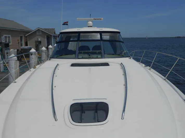  Yacht Photos Pics 2004 Sea Ray 420 Sundancer yacht docked at a marina.