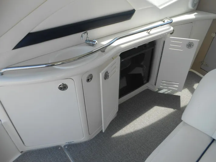  Yacht Photos Pics Interior of 2004 Sea Ray 420 Sundancer with open storage compartments.