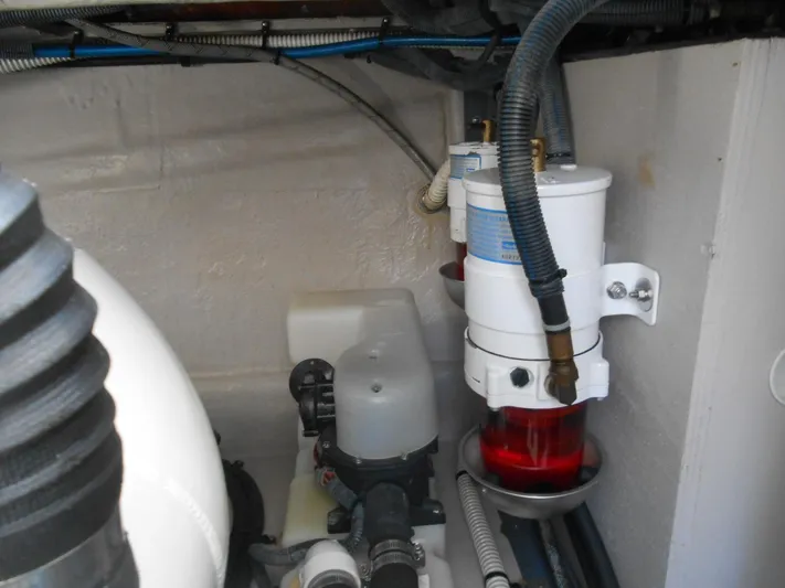  Yacht Photos Pics Engine compartment of a 2004 Sea Ray 420 Sundancer boat showing fuel filters and hoses.