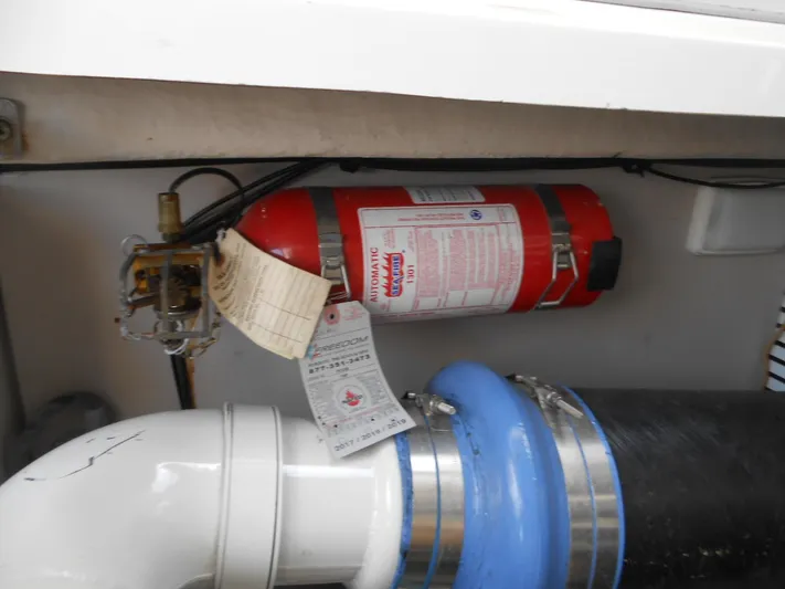  Yacht Photos Pics Fire extinguisher in the engine compartment of a 2004 Sea Ray 420 Sundancer boat.