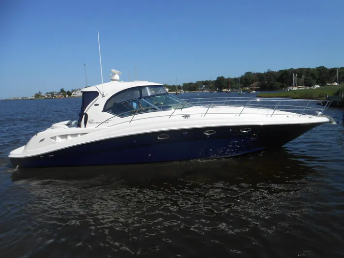  Yacht Photos Pics 2004 Sea Ray 420 Sundancer yacht cruising on a sunny day.