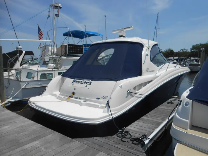  Yacht Photos Pics 2004 Sea Ray 420 Sundancer docked at a marina.