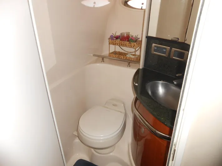  Yacht Photos Pics 2004 Sea Ray 420 Sundancer bathroom with toilet, sink, and storage.