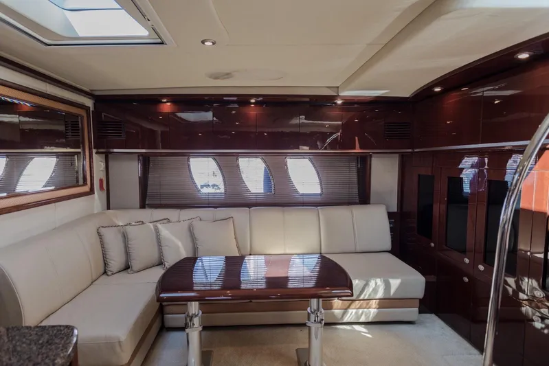  Yacht Photos Pics Luxurious interior of 2007 Sea Ray 515 Sundancer yacht with elegant seating and wooden table.