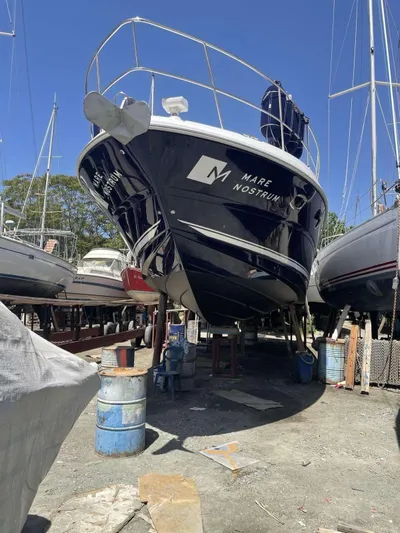  Yacht Photos Pics 2007 Sea Ray 515 Sundancer yacht on dry dock under clear blue sky.