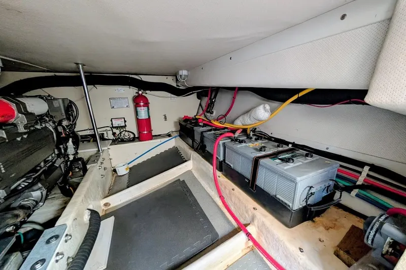Lulu Jack Yacht Photos Pics Engine room of 2008 Mainship 38 with batteries and fire extinguisher.