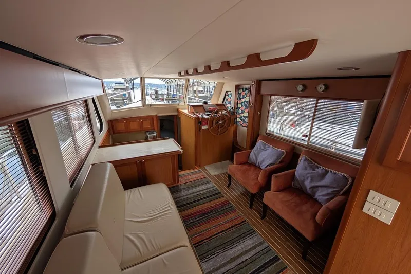 Lulu Jack Yacht Photos Pics Luxurious interior of 2008 Mainship 38 yacht with cozy seating and helm station.